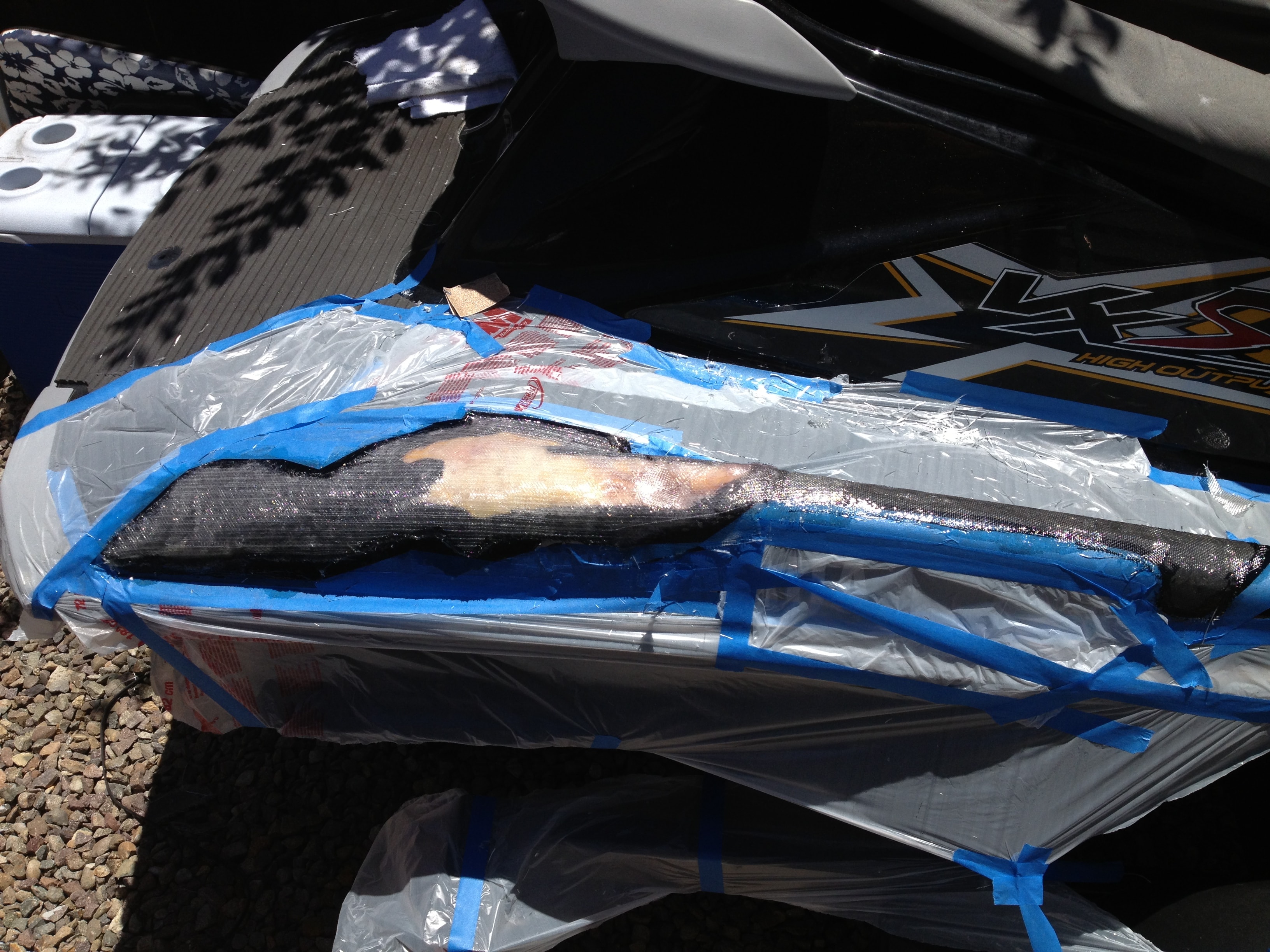Step 6 — PWC repair masked and curing, San Diego Yacht Repair